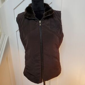 Black quilted vest with fur trim and animal print